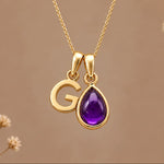 Gold initial G necklace with a natural February amethyst