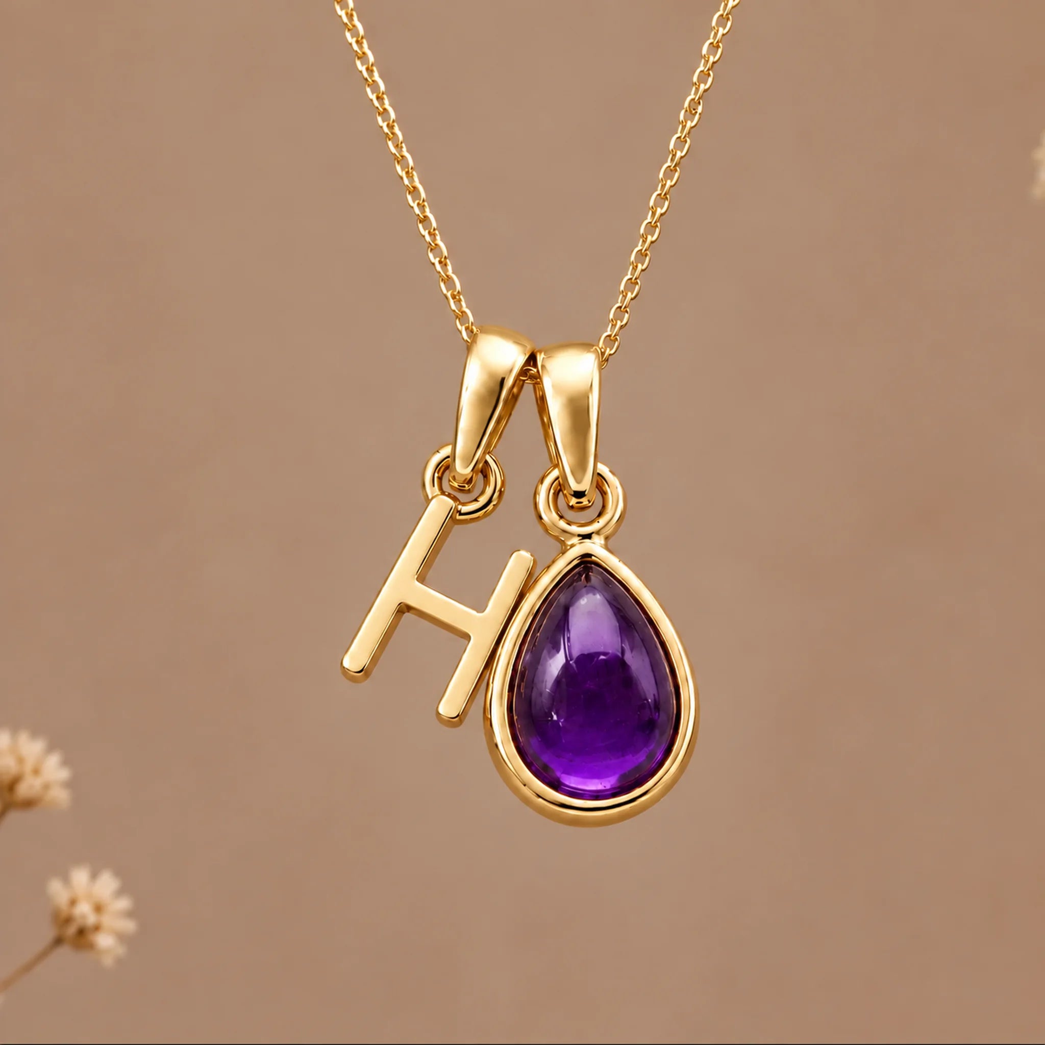 Gold initial H necklace with a natural February amethyst