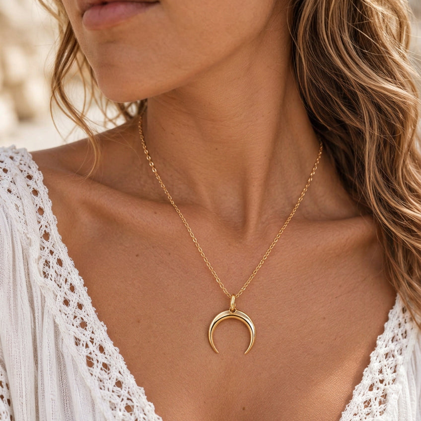 Gold Half Moon Pendant Necklace worn by a model in a white lace top