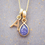 Gold Initial A Pendant and December birthstone tanzanite Necklace by indie and harper australia