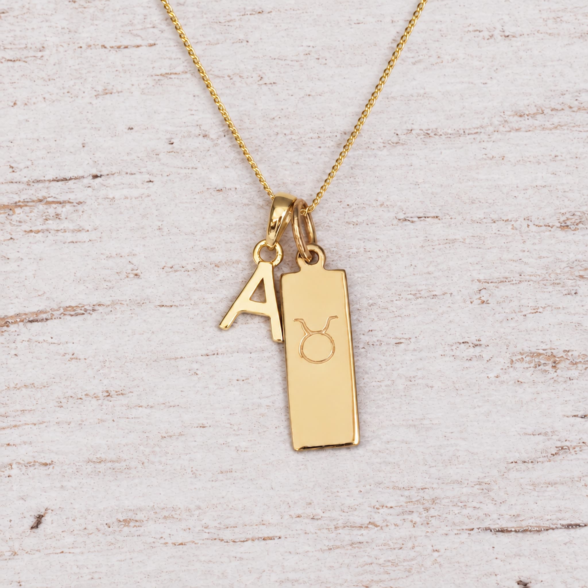 Gold Initial and Taurus Zodiac Necklace with letter A pendant