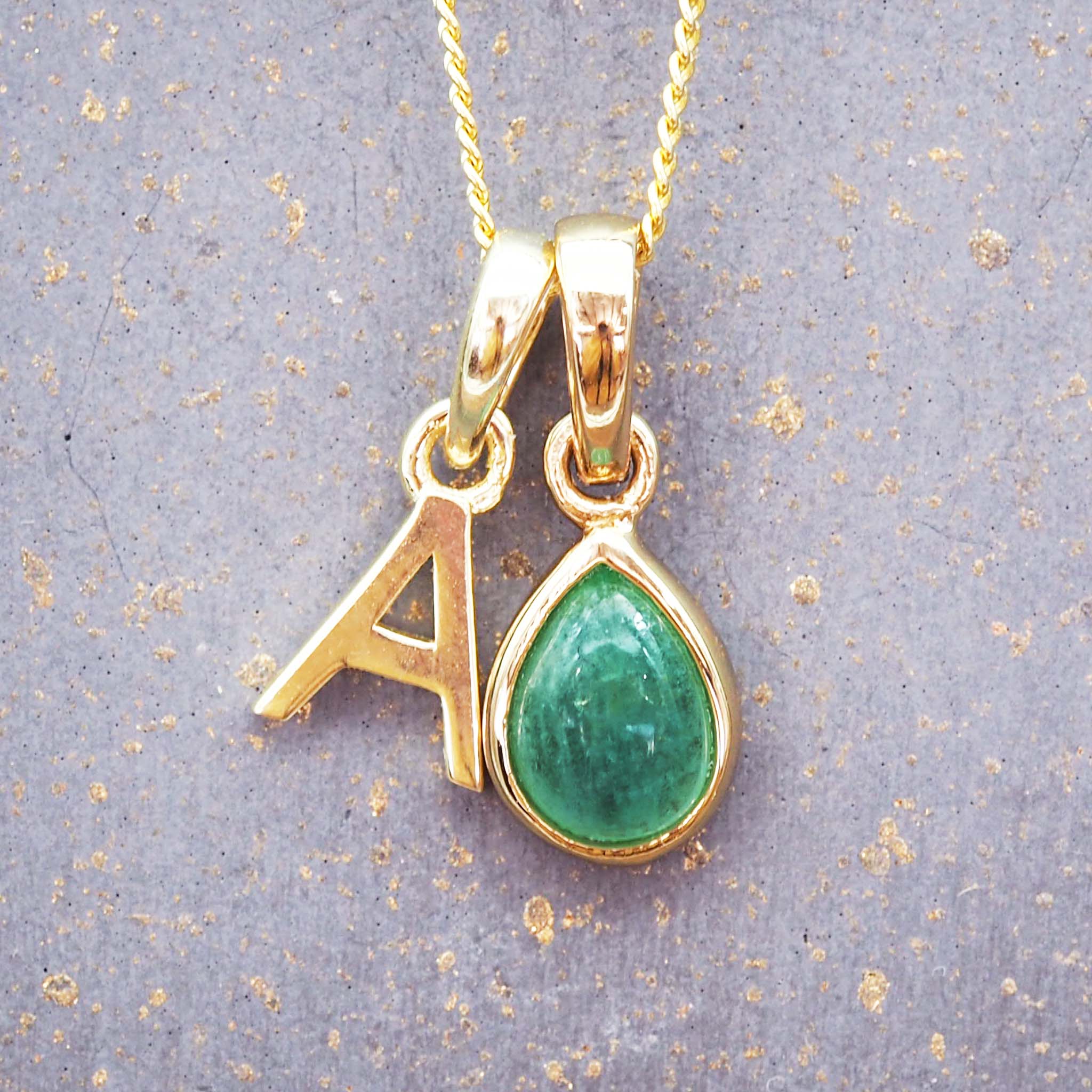 Gold initial and may birthstone emerald necklace by indie and Harper Australia 