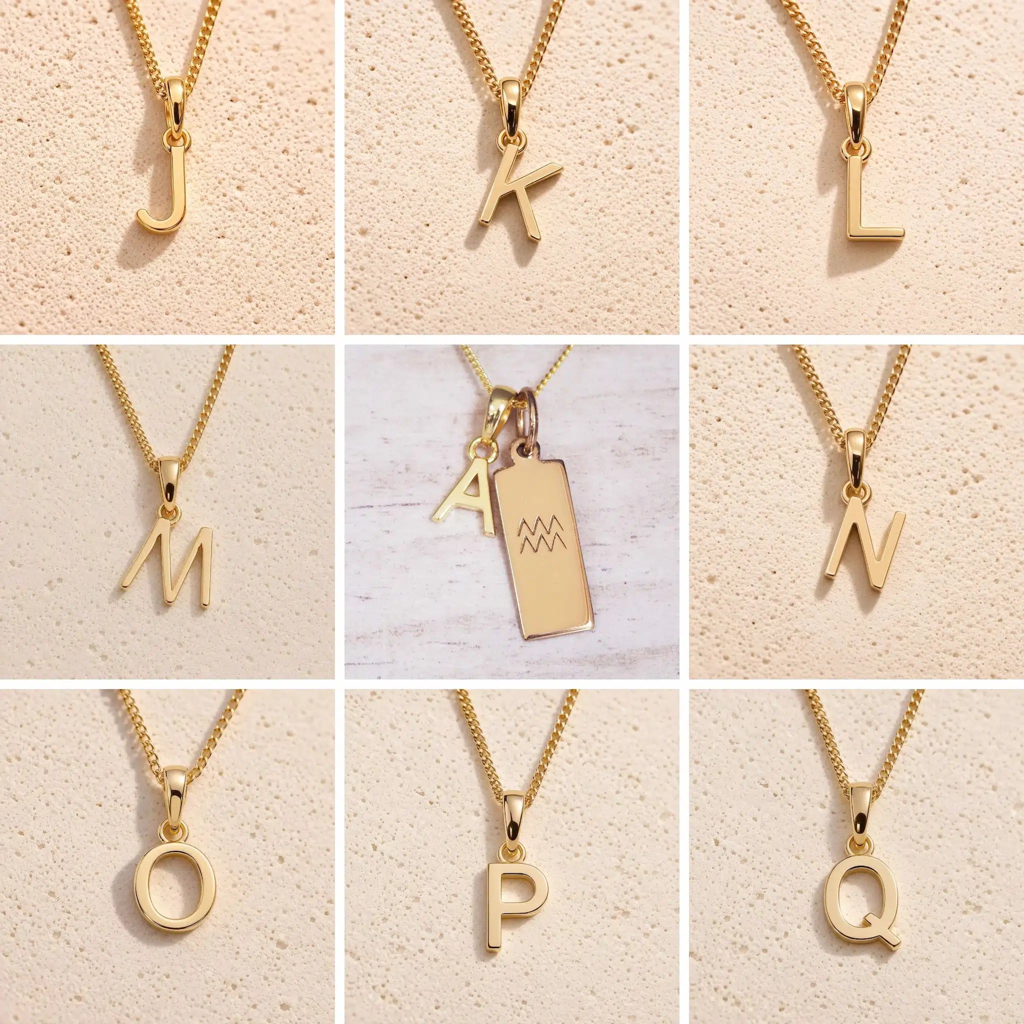 Collection of gold fine chain necklaces with gold letter pendants J to Q, as personalised initial charms for Aquarius Zodiac Necklace on a beige background