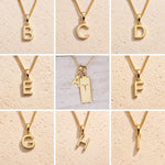 grid of Gold fine chain necklaces with uppercase initial charms A to H on a beige background as personalised gold letter pendant options on a Aries Zodiac Necklace.