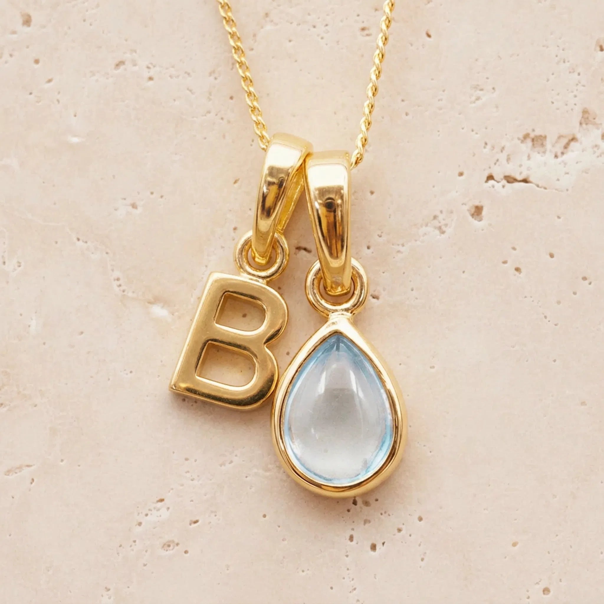 Gold Initial B Pendant and November birthstone natural light blue topaz teardrop pendant on a fine gold chain