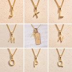 Collage of gold necklaces with letters J to Q on a beige background as gold letter charm options for personalised Capricorn Zodiac Necklace