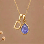 Gold Initial D and December Birthstone natural Tanzanite Necklace on a warm background