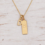 Gold Initial and Taurus Zodiac Necklace with letter D pendant