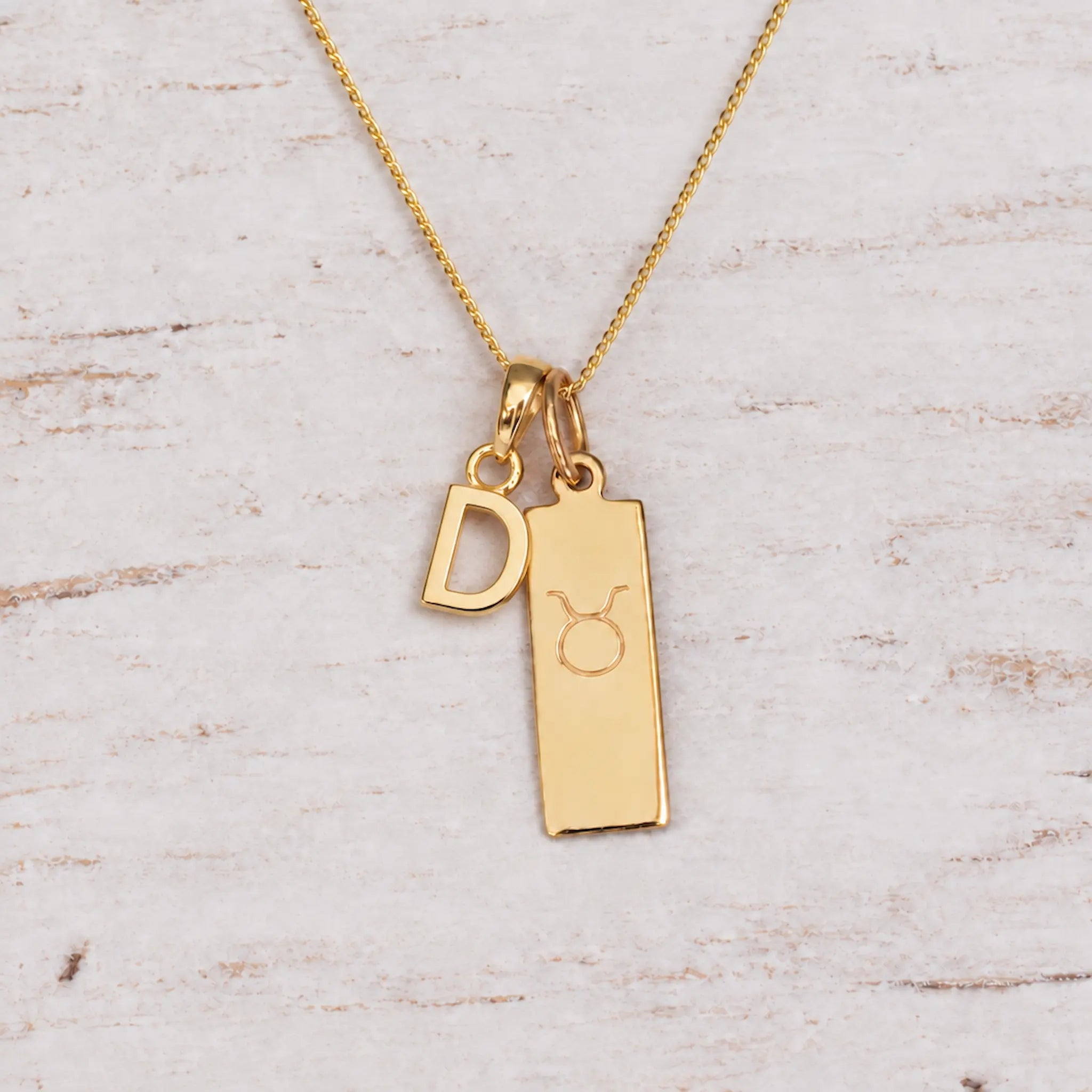 Gold Initial and Taurus Zodiac Necklace with letter D pendant