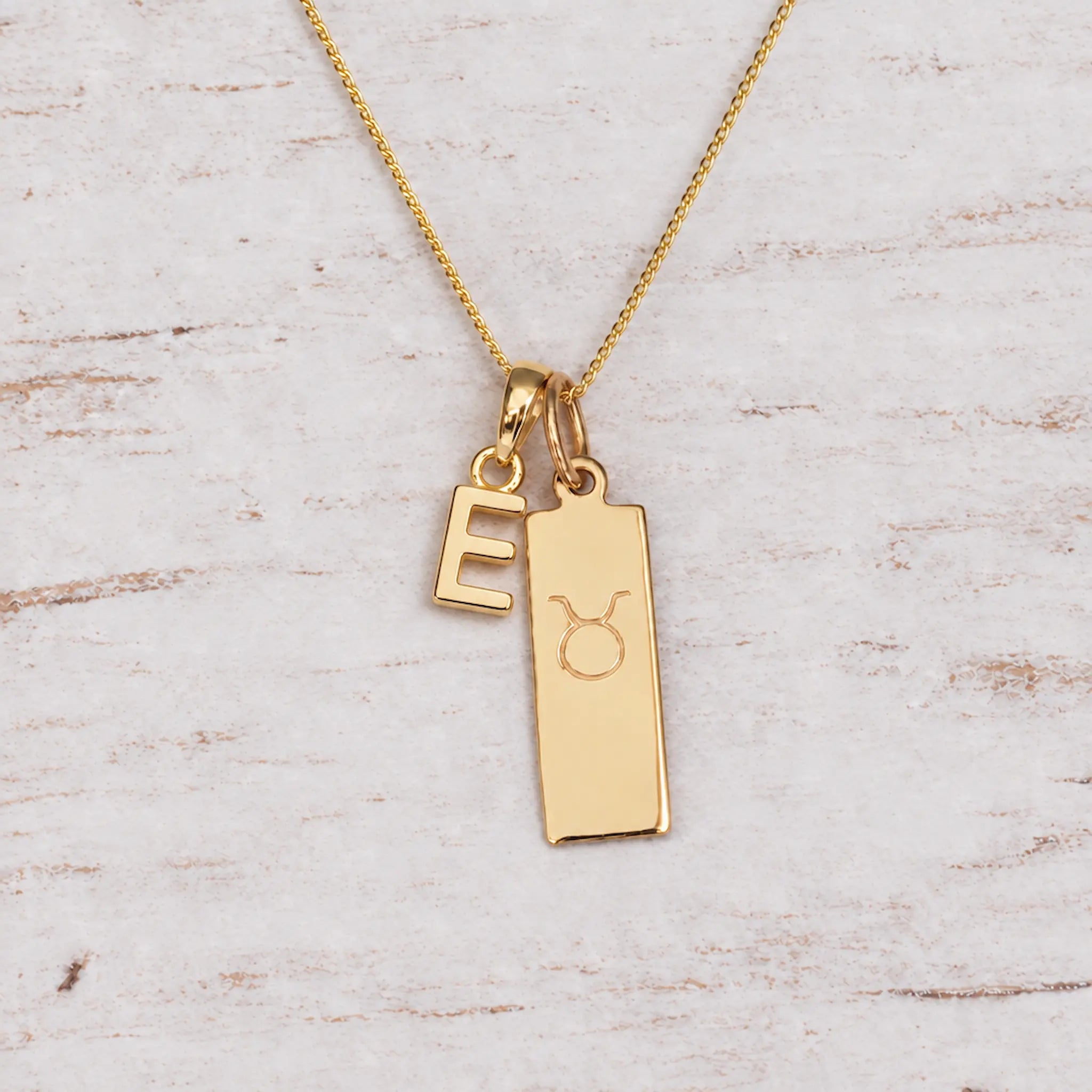 Gold Initial and Taurus Zodiac Necklace with letter E pendant