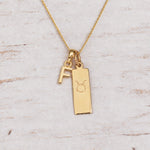 Gold Initial and Taurus Zodiac Necklace with letter F pendant