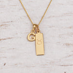 Gold Initial and Taurus Zodiac Necklace with letter G pendant