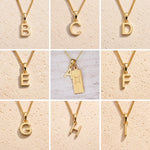 Collage of gold necklaces with letters A to H on a beige background as Gold Letter Pendant Options to personalise the Gemini Zodiac Necklace.