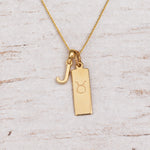 Gold Initial and Taurus Zodiac Necklace with letter J pendant