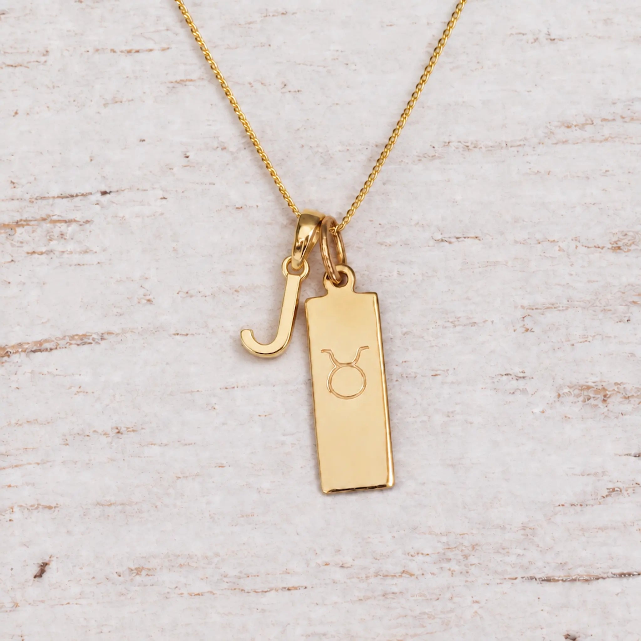Gold Initial and Taurus Zodiac Necklace with letter J pendant