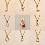 collage grid collection of gold fine chain necklaces with uppercase initial pendants J, K, L, M, A, N, O, P, Q on a light background, as personalised options on a July Birthstone Ruby Necklace.