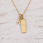 Gold Initial and Taurus Zodiac Necklace with letter K pendant