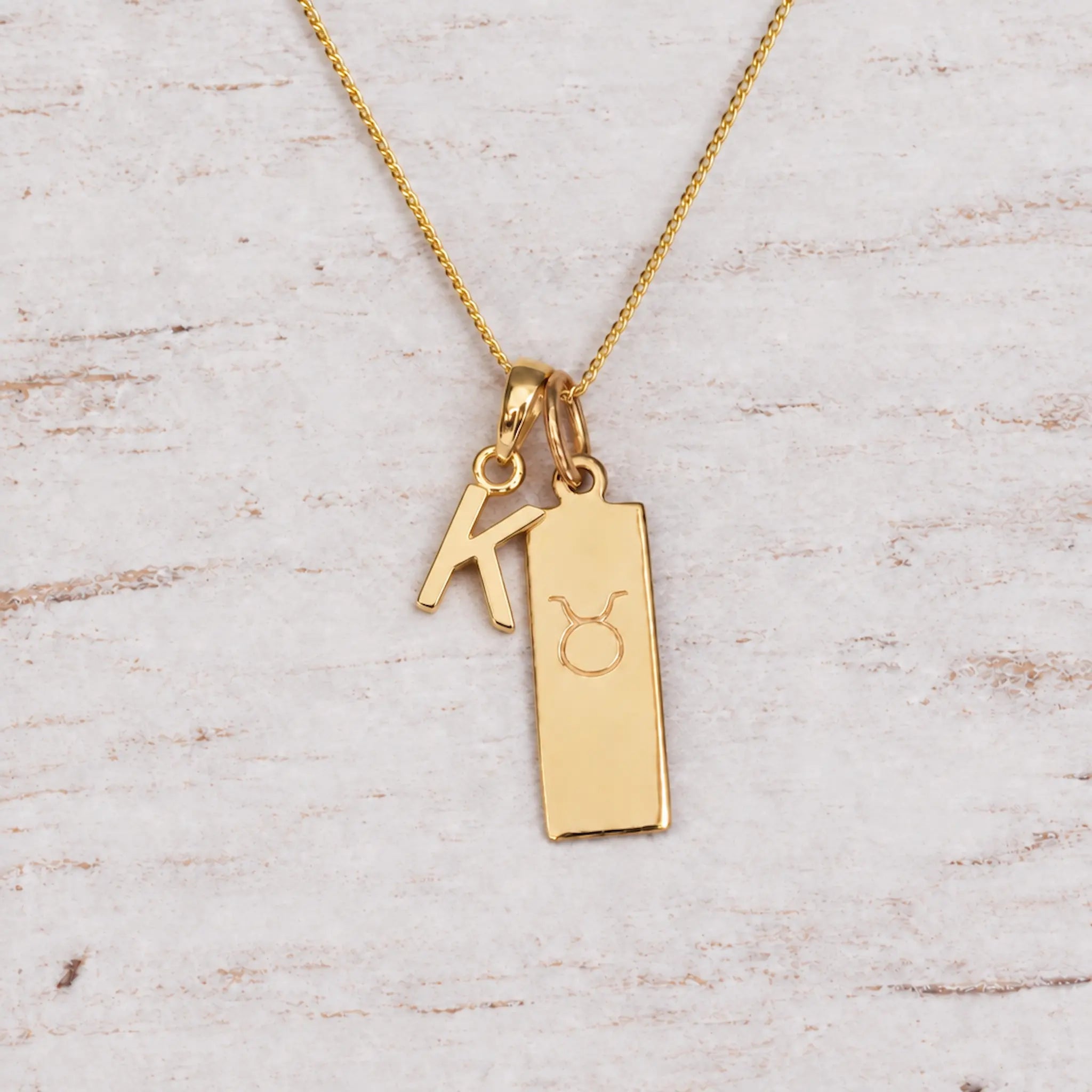Gold Initial and Taurus Zodiac Necklace with letter K pendant