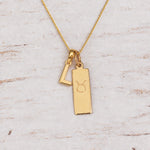 Gold Initial and Taurus Zodiac Necklace with letter L pendant