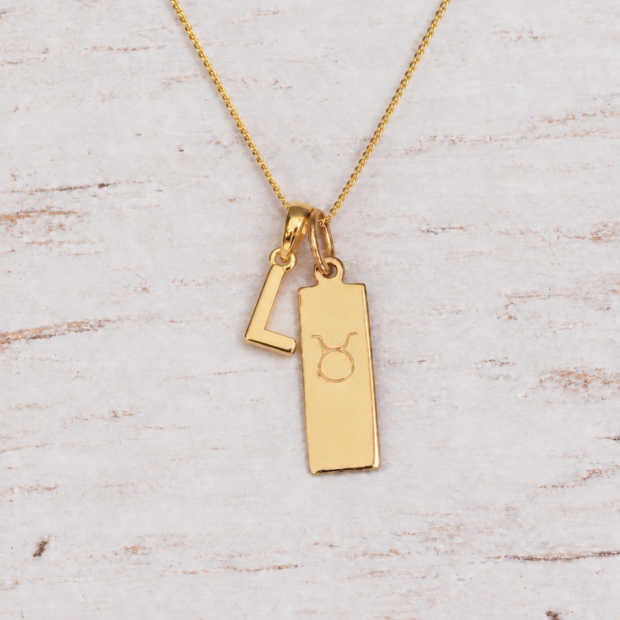 Gold Initial and Taurus Zodiac Necklace with letter L pendant