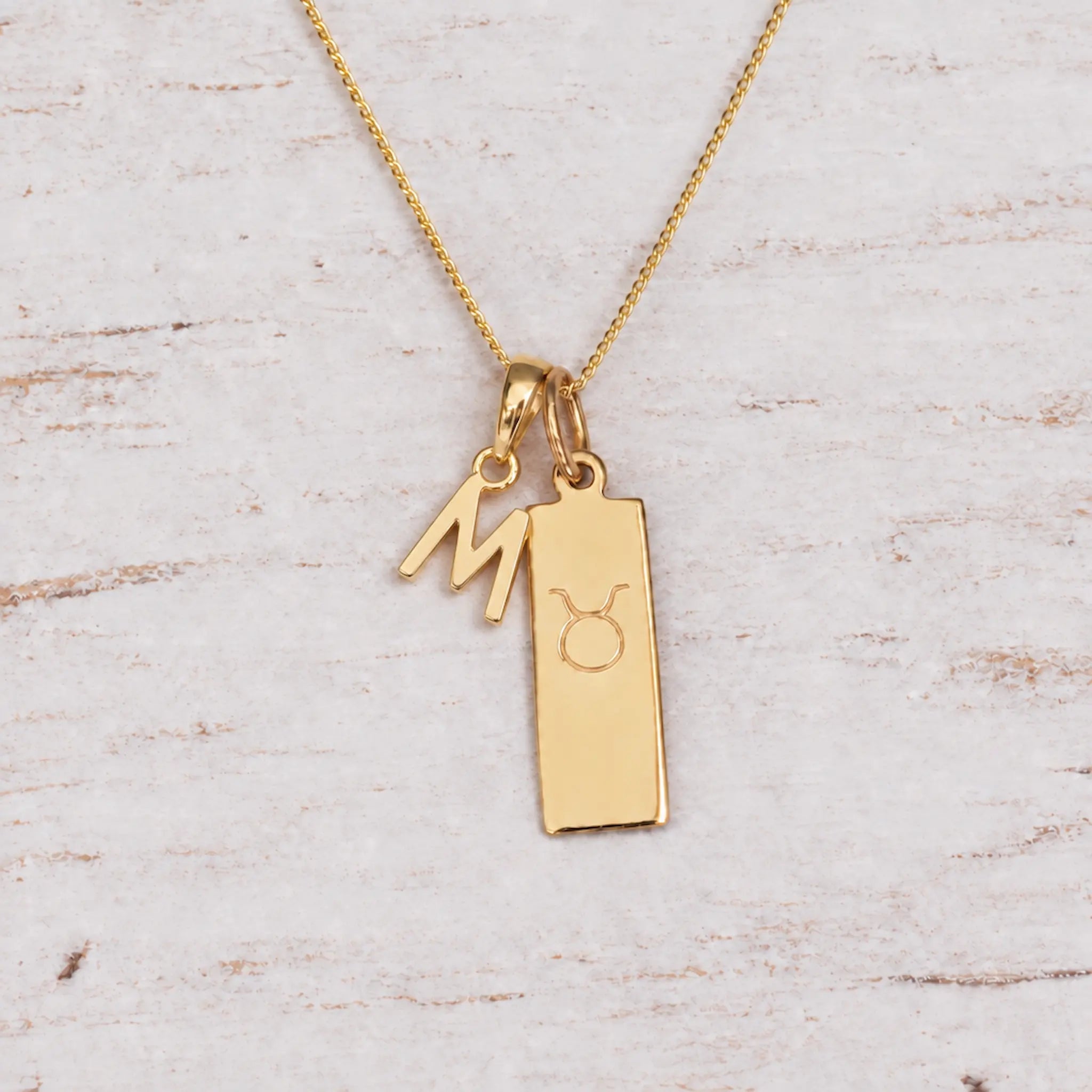 Gold Initial and Taurus Zodiac Necklace with letter M pendant