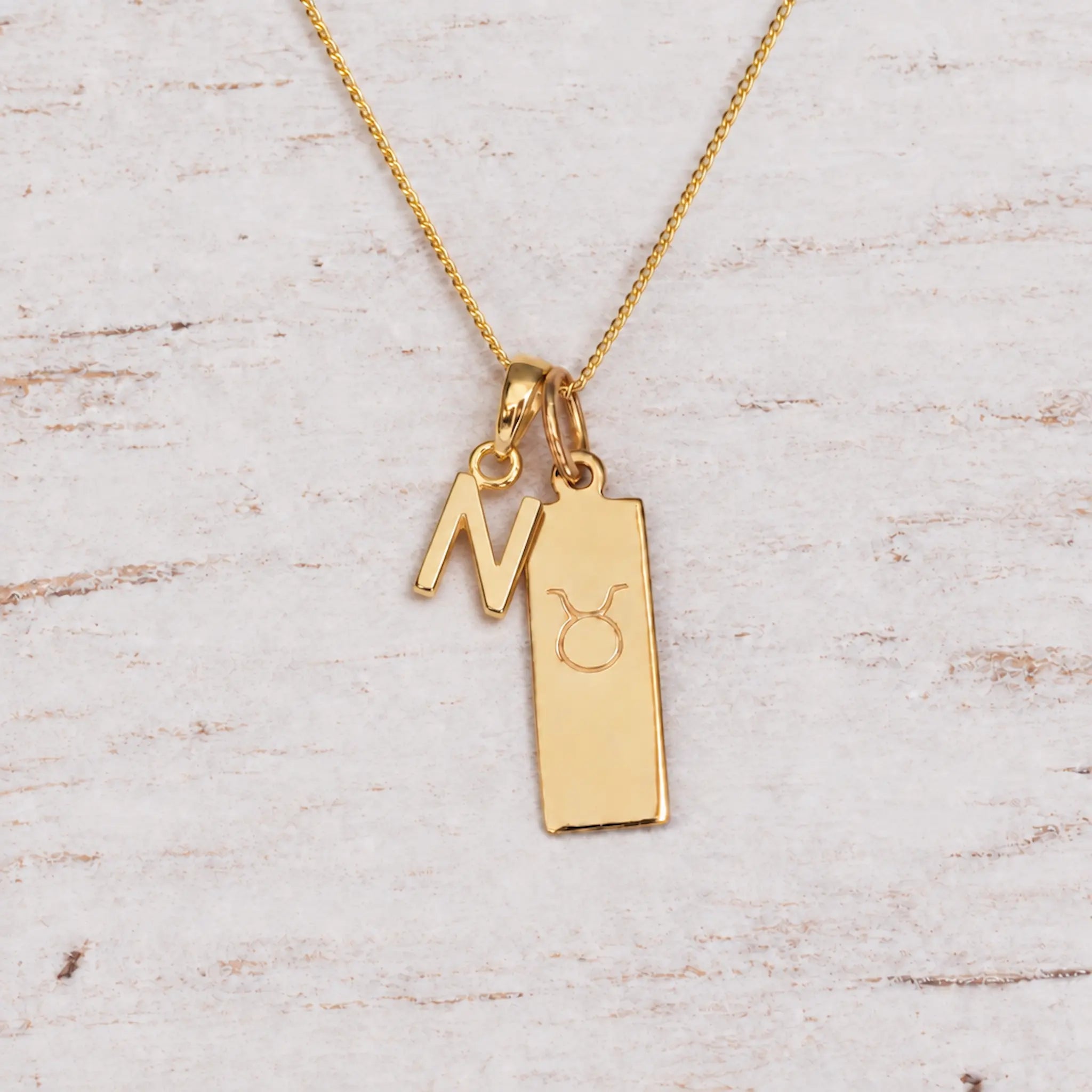 Gold Initial and Taurus Zodiac Necklace with letter N pendant