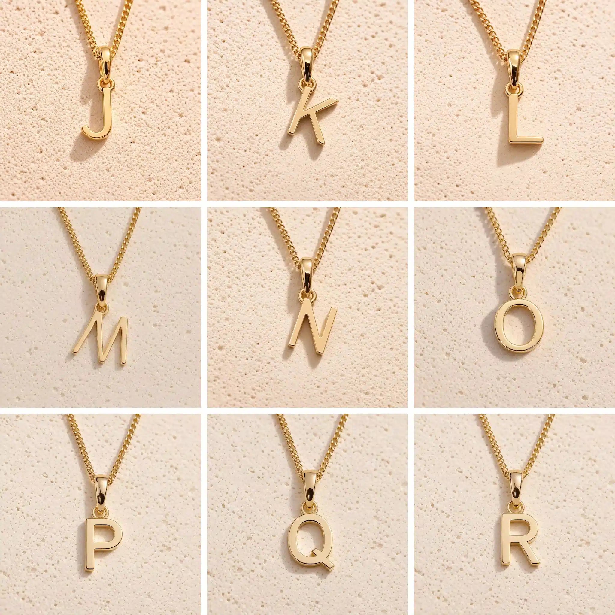 3 x 3 grid showing gold initial necklace charms J, K, L, M, N, O, P, Q and R on fine cable chains against a beige stone background, showing personalised letter options for the Leo zodiac necklace
