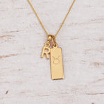 Gold Initial and Taurus Zodiac Necklace with letter R pendant