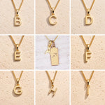 Gold necklaces with letters B to H on a beige background as letter charm options for Gold Sagittarius Zodiac Star Sign Necklace with Gold A Initial Sagittarius Zodiac Necklace in the middle