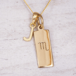 Gold necklace with a 'J' initial pendant and a Scorpio zodiac symbol on a light gray background