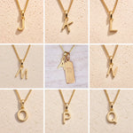 Gold necklaces with letter pendants on a beige background showing the gold initial options a, j, k, l, m, n, o, p, q for the personalised virgo zodiac necklace