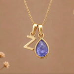 Gold Initial Z and December Birthstone natural Tanzanite Necklace on a warm background