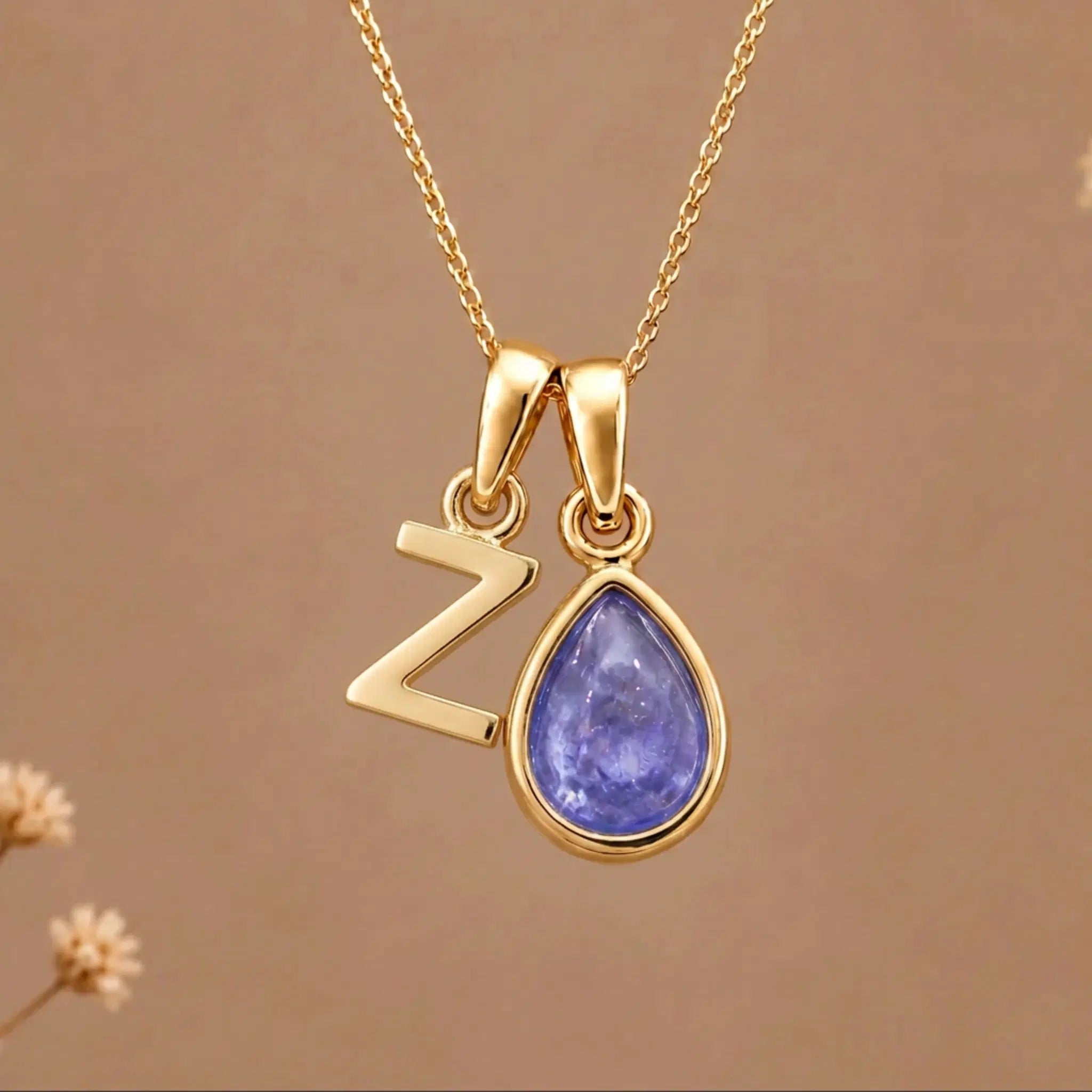 Gold Initial Z and December Birthstone natural Tanzanite Necklace on a warm background