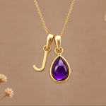 Gold initial J necklace with a natural February amethyst
