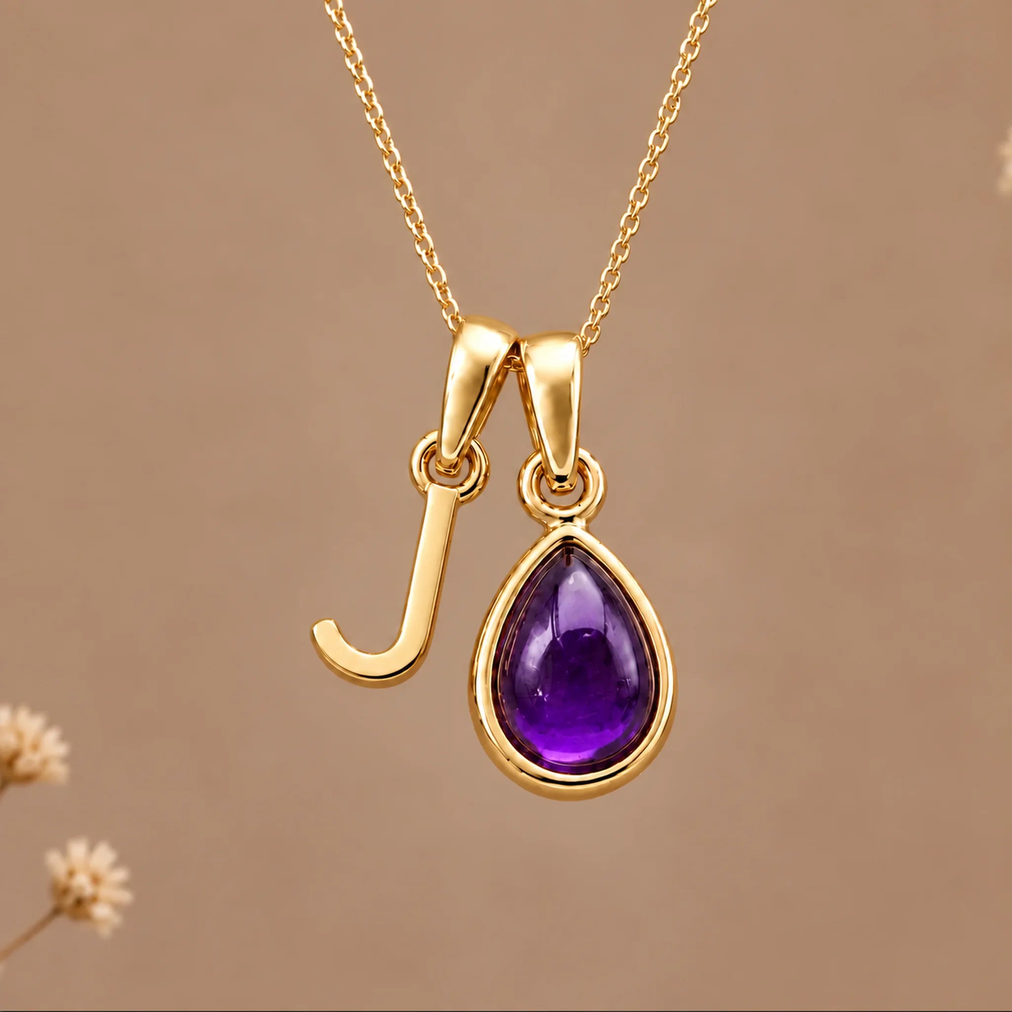 Gold initial J necklace with a natural February amethyst