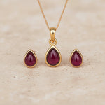 Gold January Birthstone Garnet Jewellery Set including pear-shaped Garnet stud earrings and pendant necklace