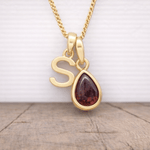 gold January birthstone necklace with a pear-shaped natural garnet gemstone and 's' initial pendant - Personalised Birthday Gift
