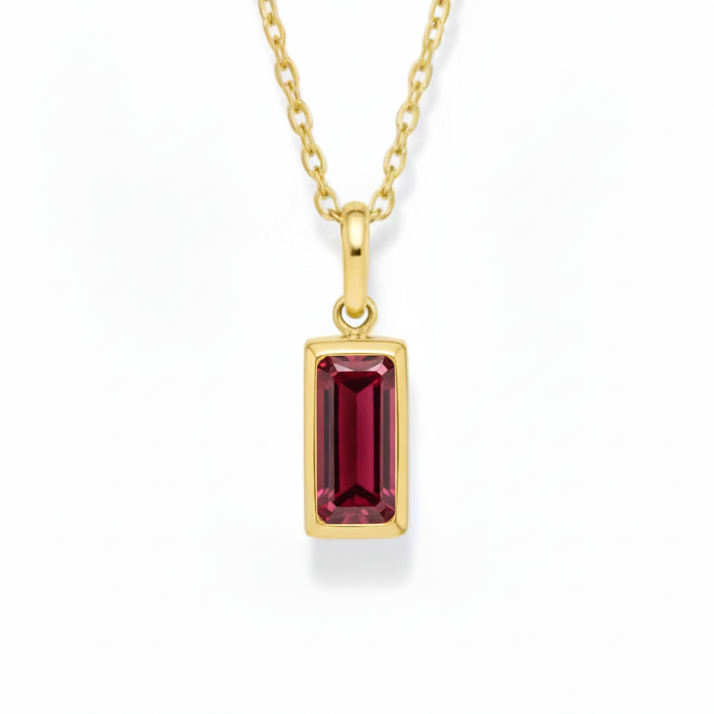 Gold necklace chain with a rectangle garnet coloured gemstone 