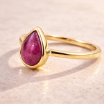 Gold July birthstone Ring with pear-shaped natural ruby gemstone as a meaningful birthday jewellery gift for her.