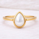 Gold June Birthstone Ring with pear-shaped pearl as a meaningful june birthstone jewellery gift for her
