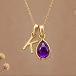 Gold initial K necklace with a natural February amethyst