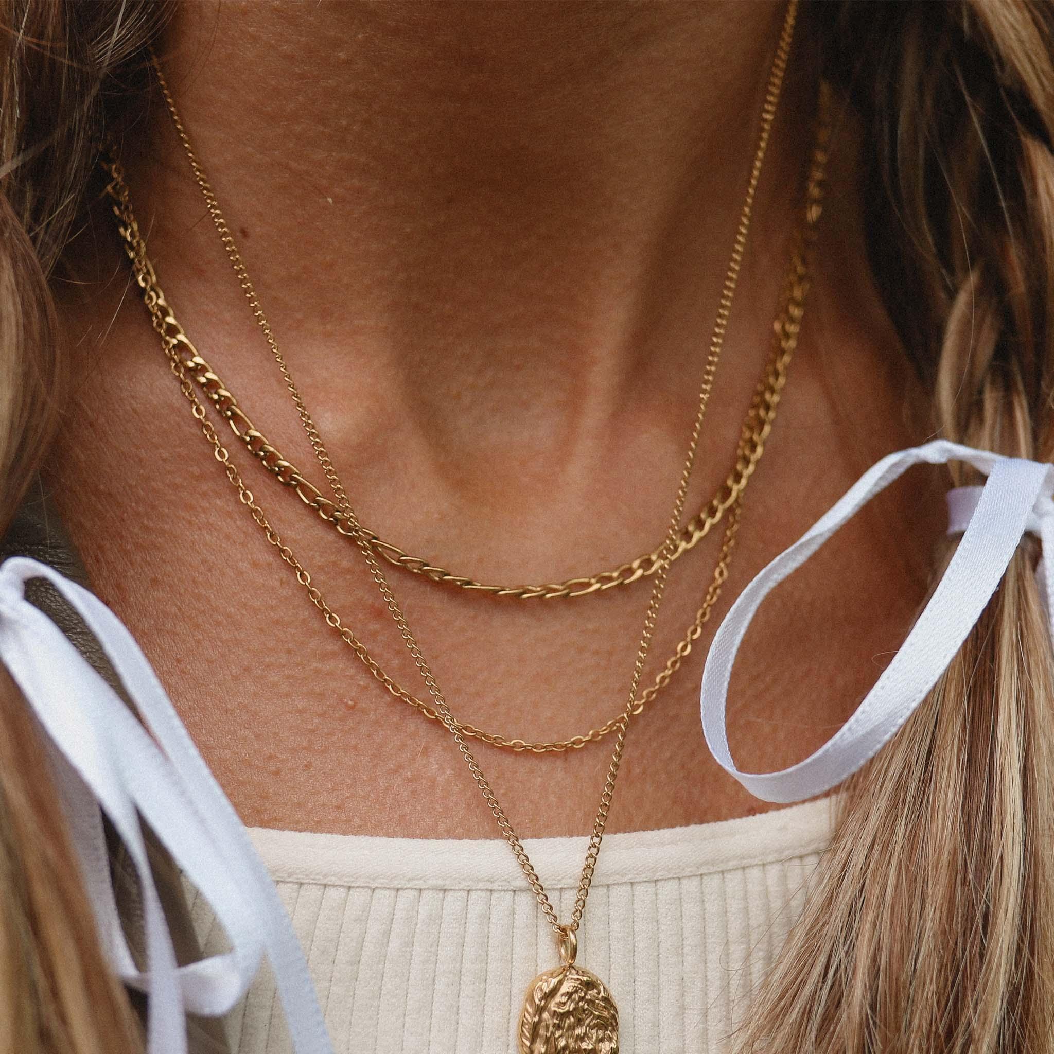 Woman wearing Gold layered Necklaces - gold waterproof jewellery by Australian jewellery brands indie and Harper
