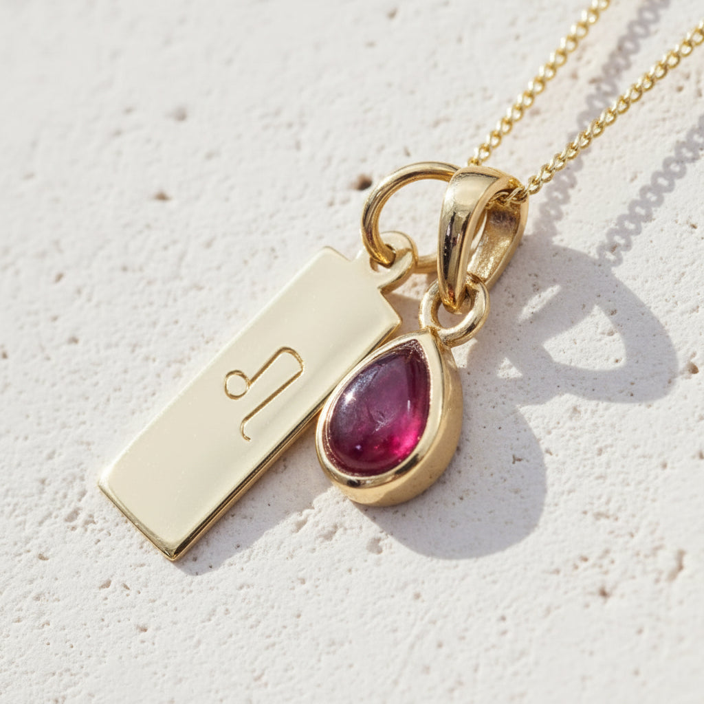 Gold Leo star sign necklace with a deep red genuine ruby July birthstone charm 