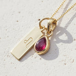 Gold Leo star sign necklace with a deep red genuine ruby July birthstone charm 