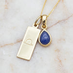 Gold Libra Zodiac necklace with a September birthstone natural sapphire gemstone pendant