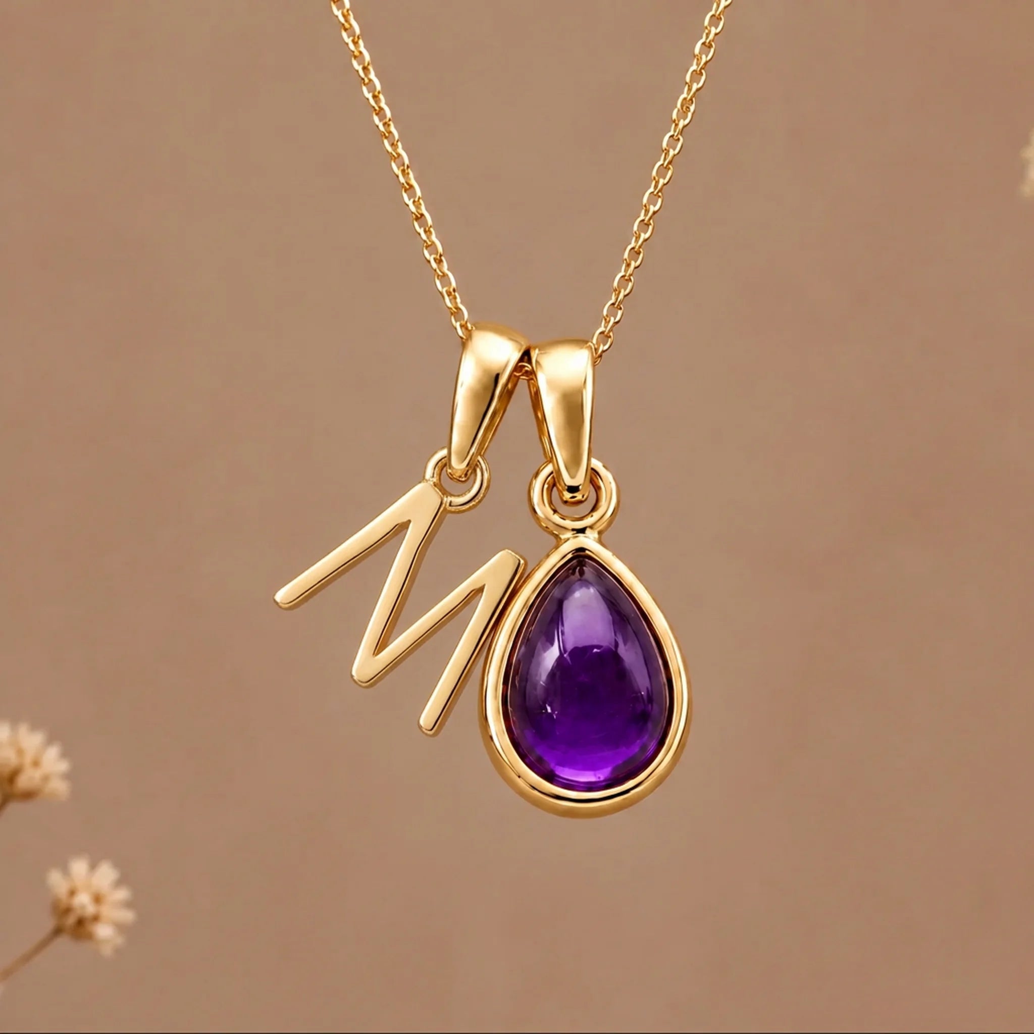 Gold initial M necklace with a natural February amethyst