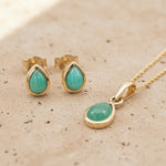gold may birthstone jewellery gift set with natural emerald gemstone stud earrings and necklace 