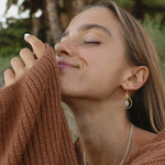 gold Moonstone teardrop Earrings being worn
