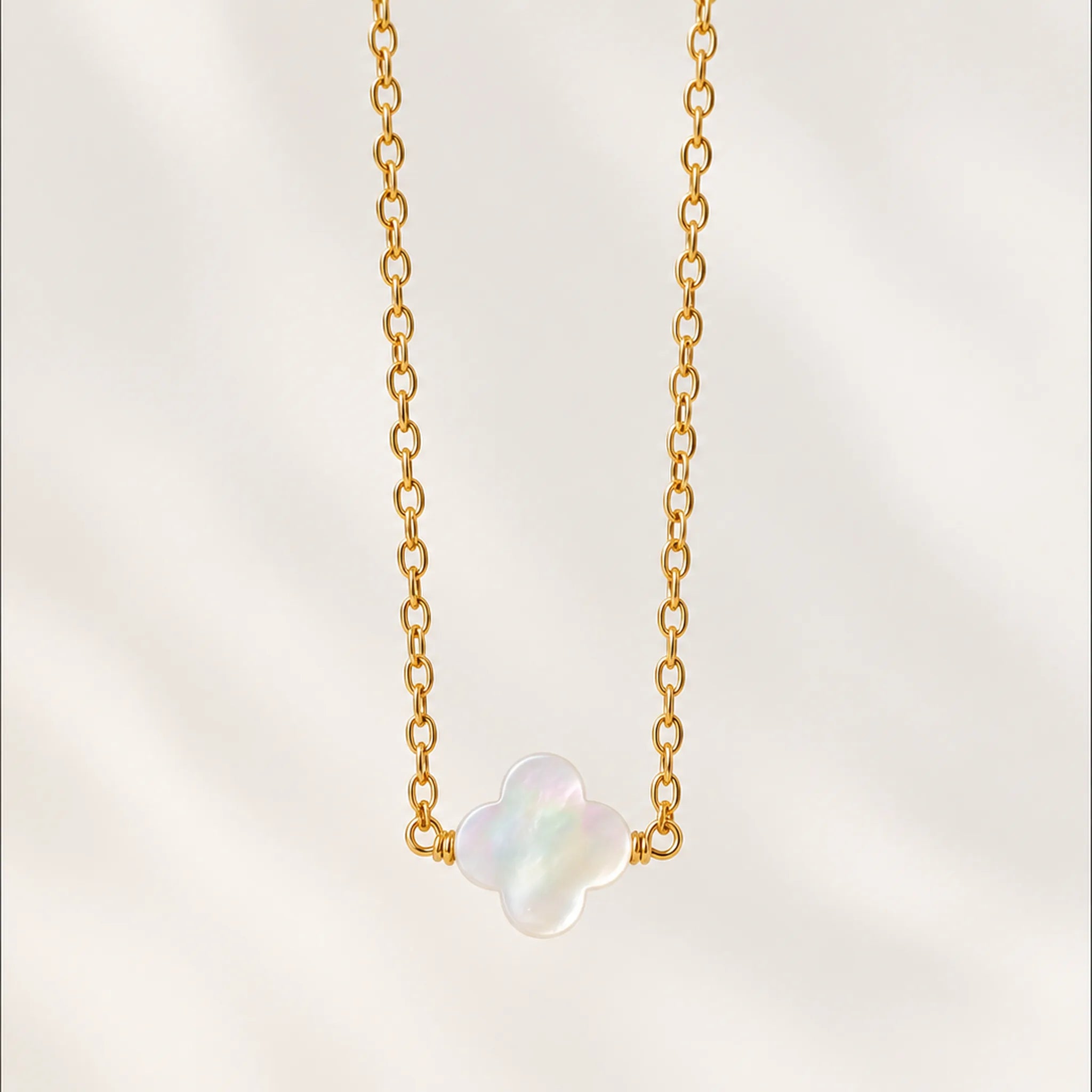 Close view of mother of pearl clover necklace