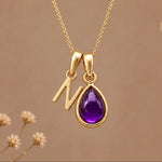 Gold initial N necklace with a natural February amethyst